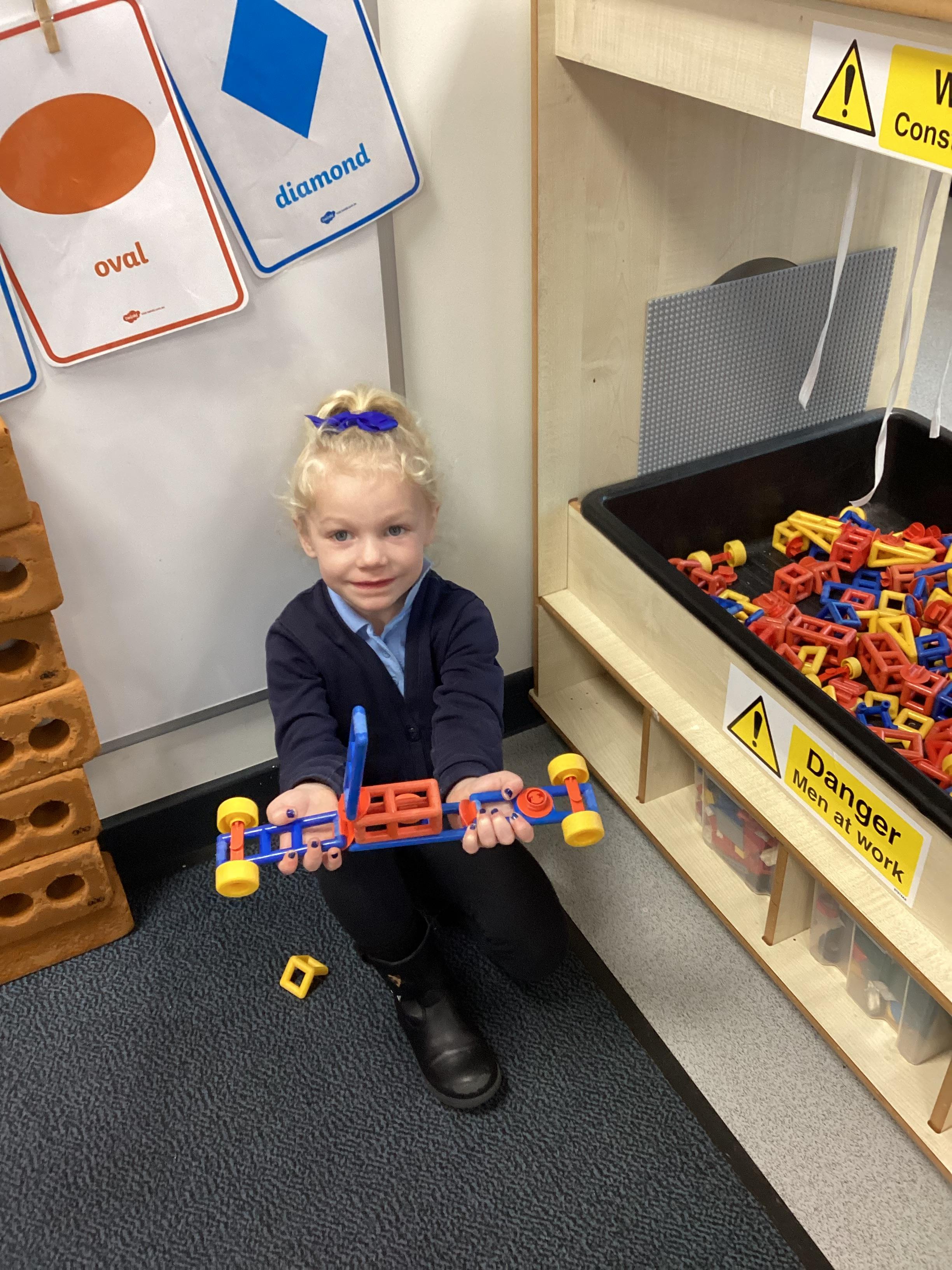 I made a car with four wheels and a seat!